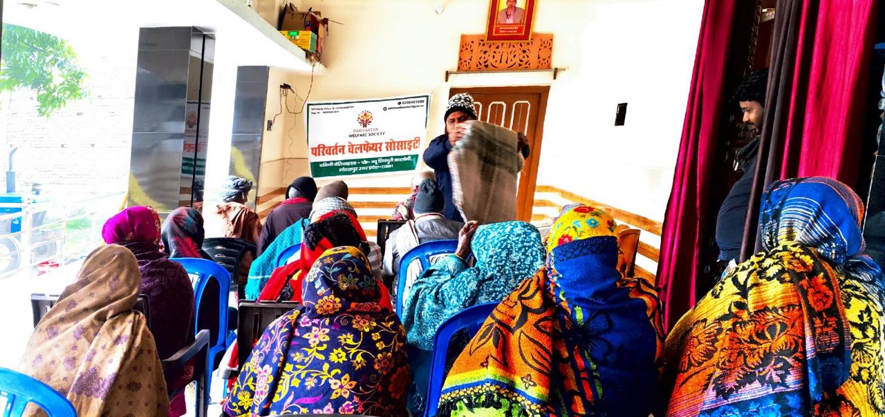 Parivartan Welfare Society volunteers handing warm blankets in cold weather